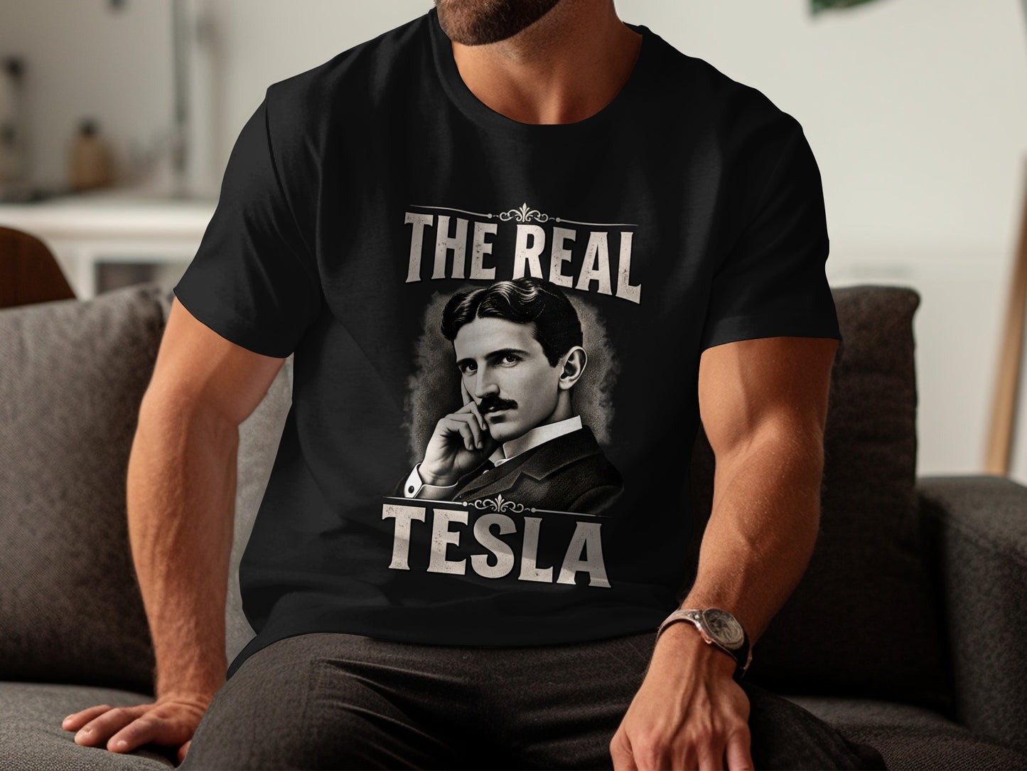 Black t-shirt with a portrait of Nikola Tesla and text "The Real Tesla".