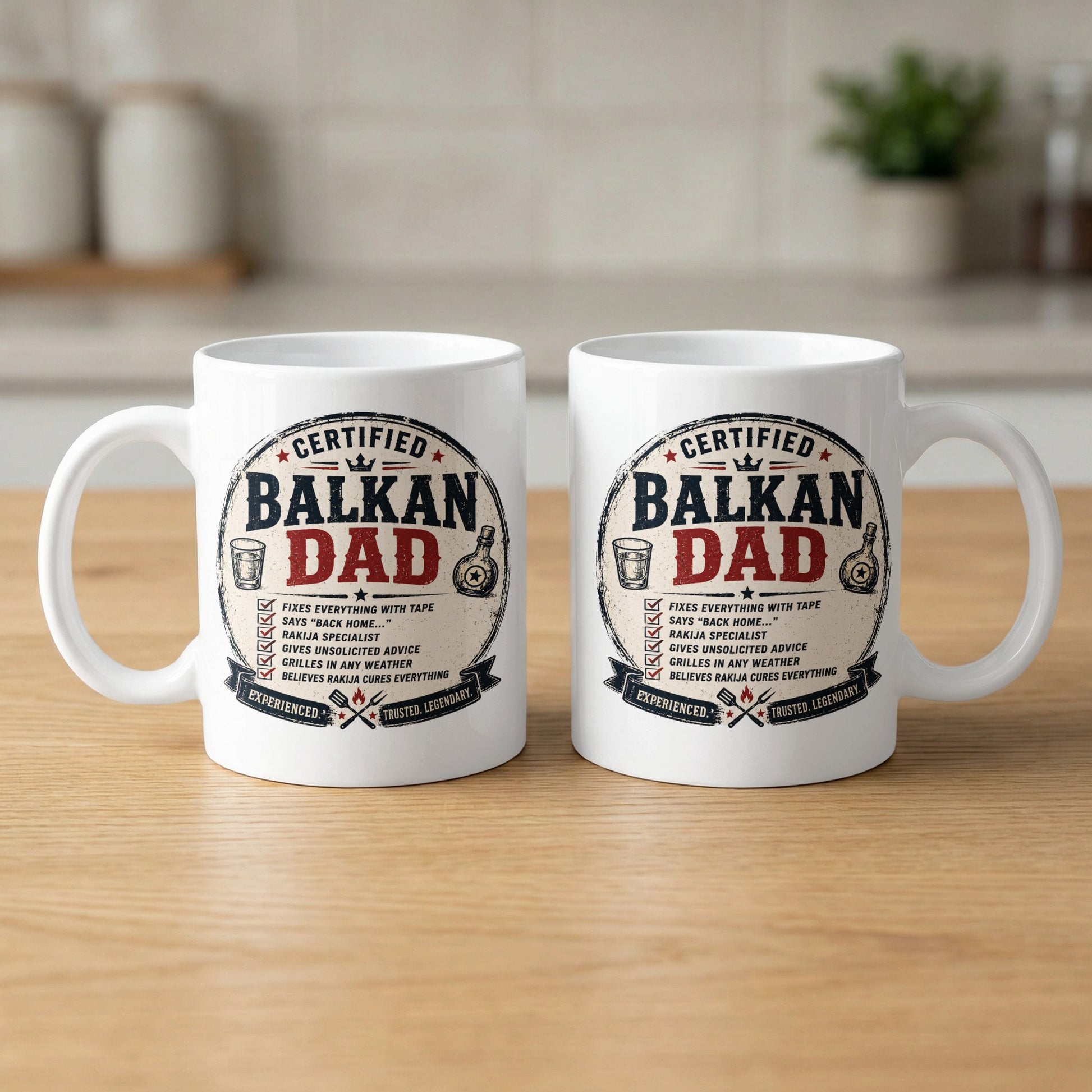 Two white ceramic mugs with "Certified Balkan Dad" text and humorous claims.