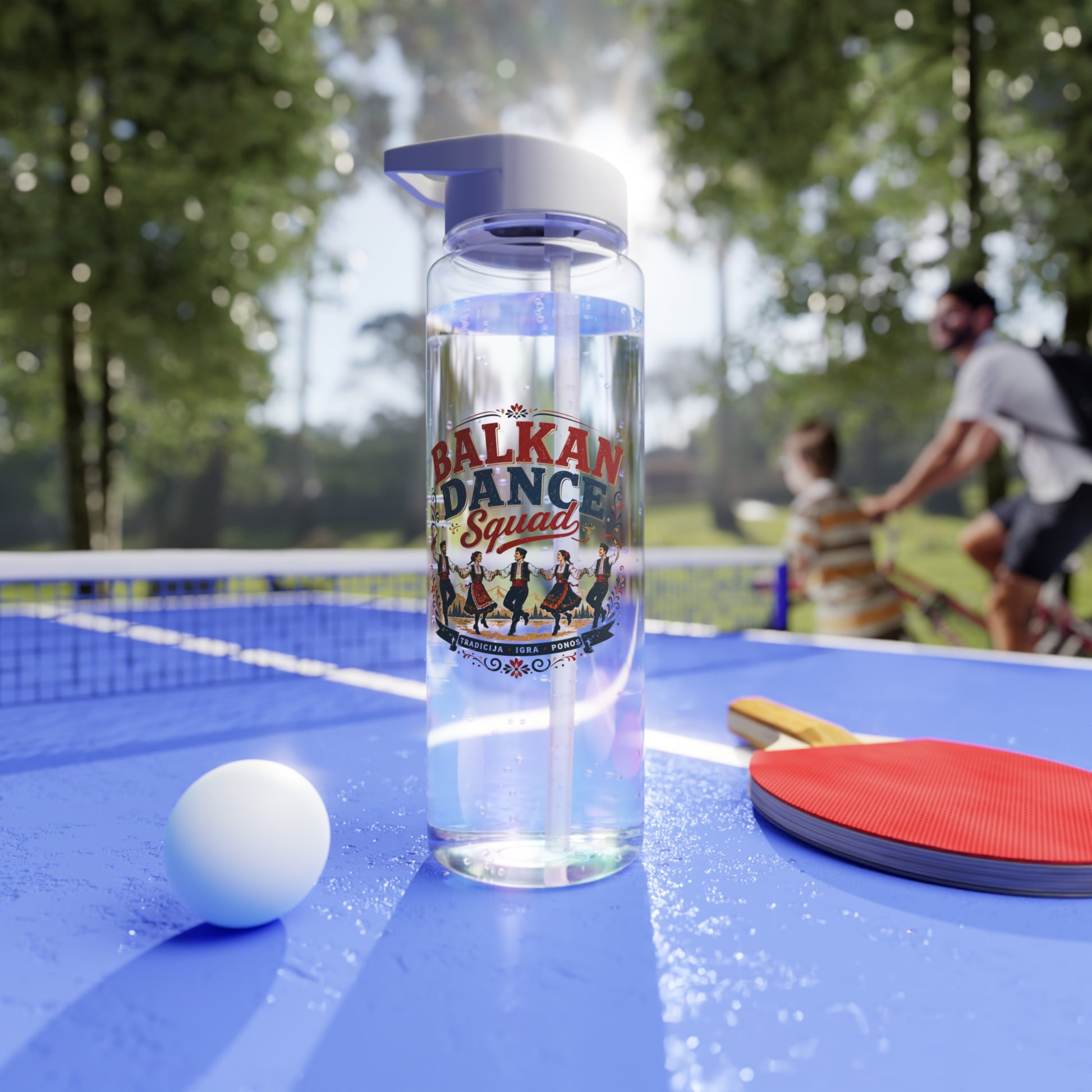 Clear water bottle with "BALKAN DANCE SQUAD" text and dancers on a ping pong table.