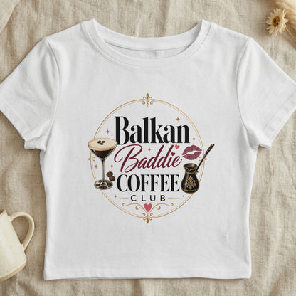 White crop top with "Balkan Baddie Coffee Club" graphic and coffee motifs.
