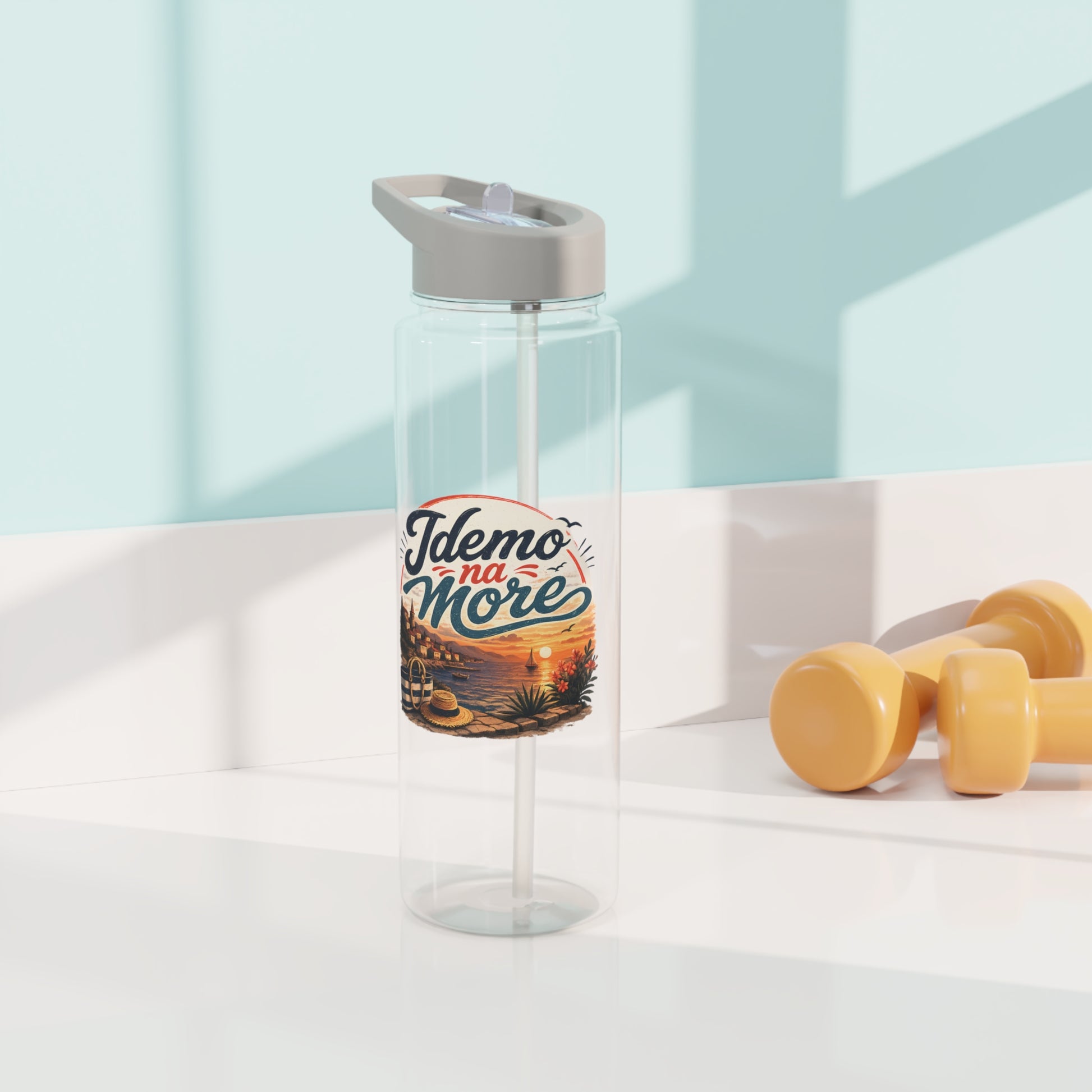 Clear water bottle with straw and "Idemo na More" text over a seaside sunset graphic.