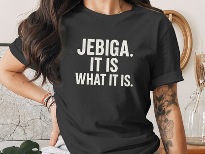 Black t-shirt with white text reading "JEBIGA. IT IS WHAT IT IS."