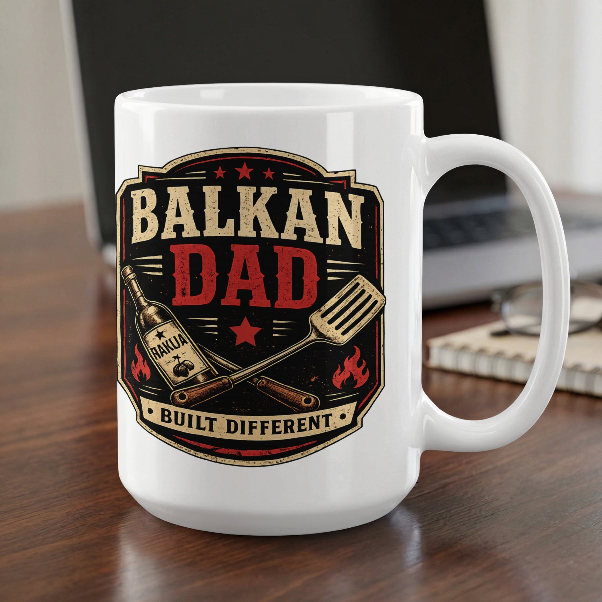 White mug with "BALKAN DAD BUILT DIFFERENT" text and barbecue graphics.