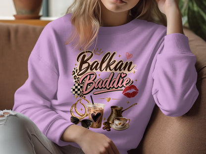 Purple sweatshirt with "Balkan Baddie" graphic and coffee shop elements.
