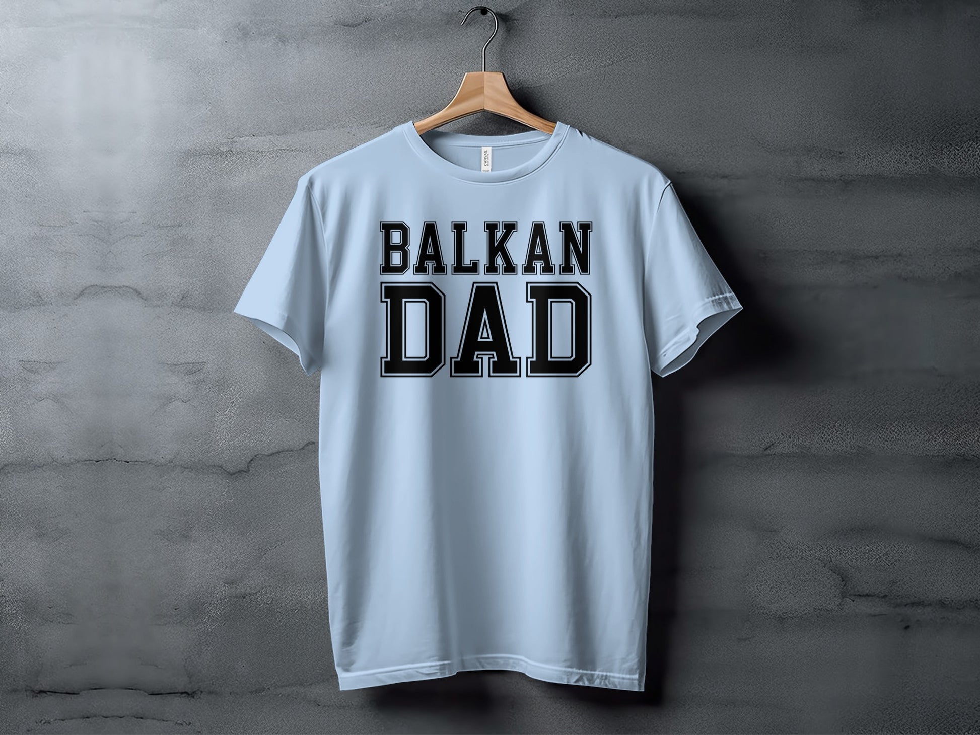 Light blue t-shirt with "BALKAN DAD" in black block letters.