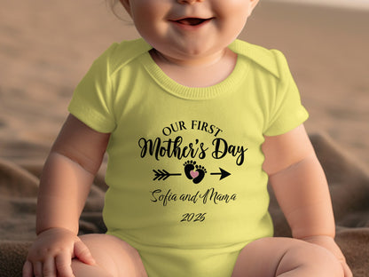 Baby in yellow onesie with "Our First Mother's Day" text.