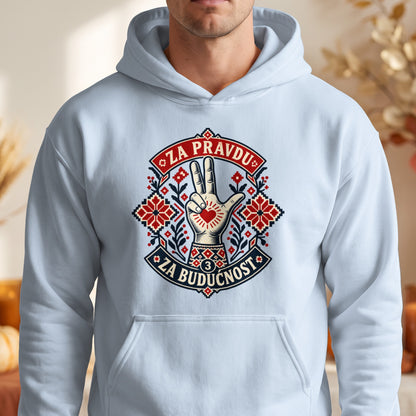 A light blue hooded sweatshirt features a centered graphic with a three-finger salute, traditional red embroidery patterns, and the text ZA PRAVDU and ZA BUDUCNOST.