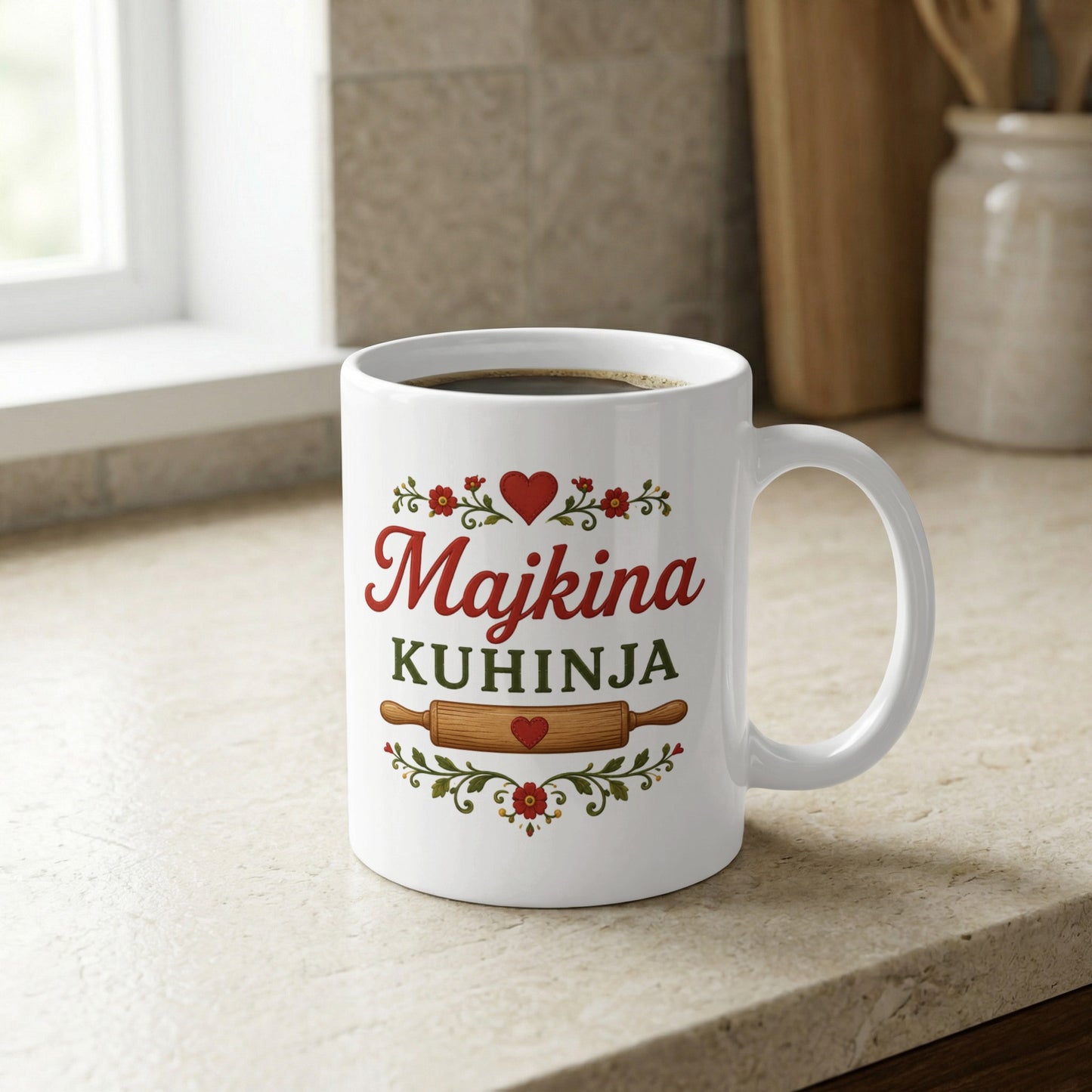 White mug with "Majkina KUHINJA" in red and green text, with rolling pin.