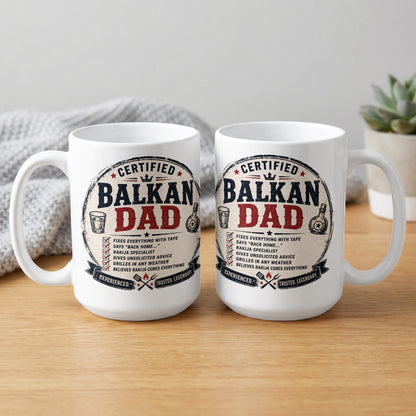 Two white mugs with "Certified Balkan Dad" text and descriptive phrases.