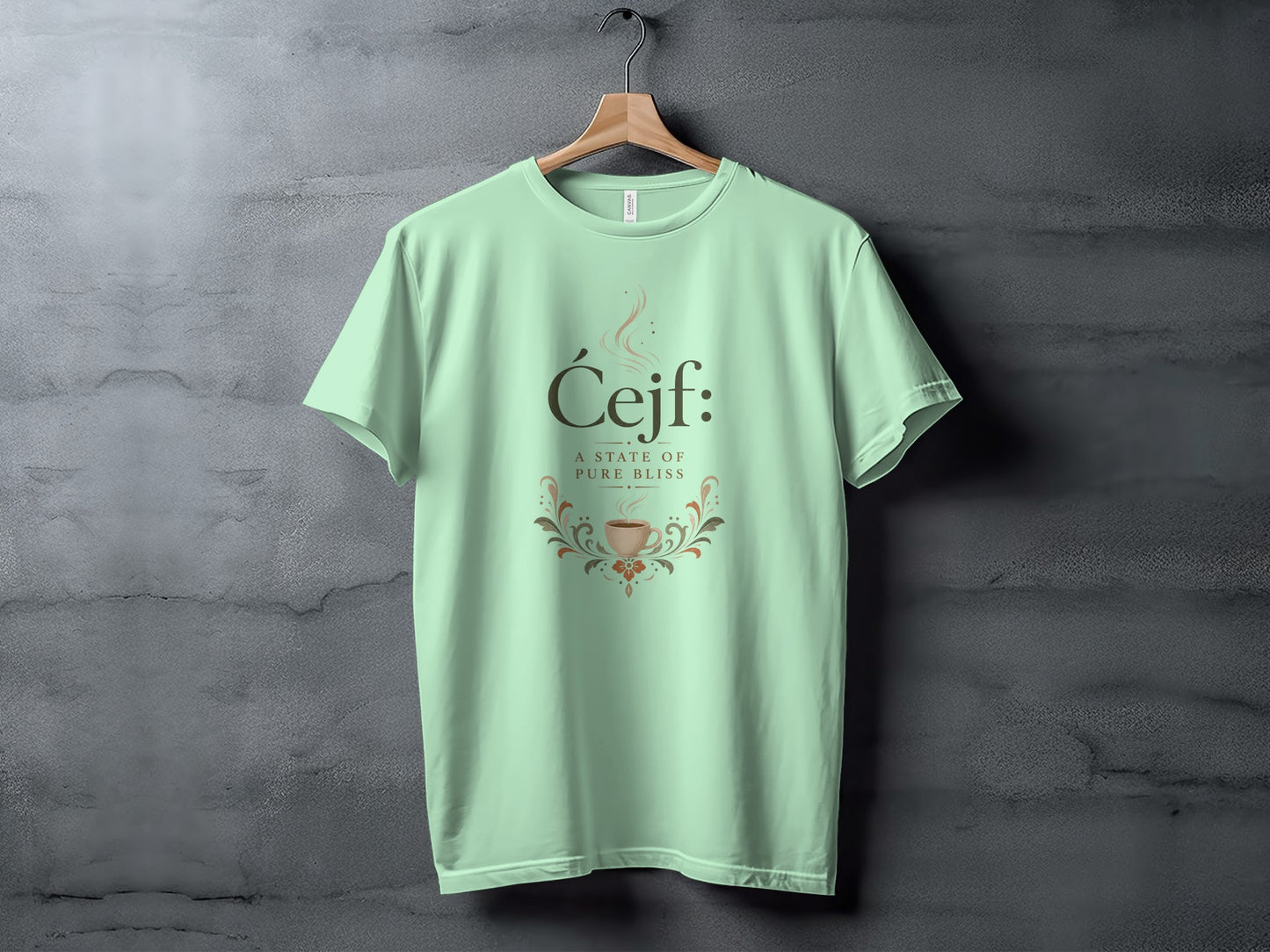 Light green t-shirt with "Ćejf: A state of pure bliss" and coffee cup design.