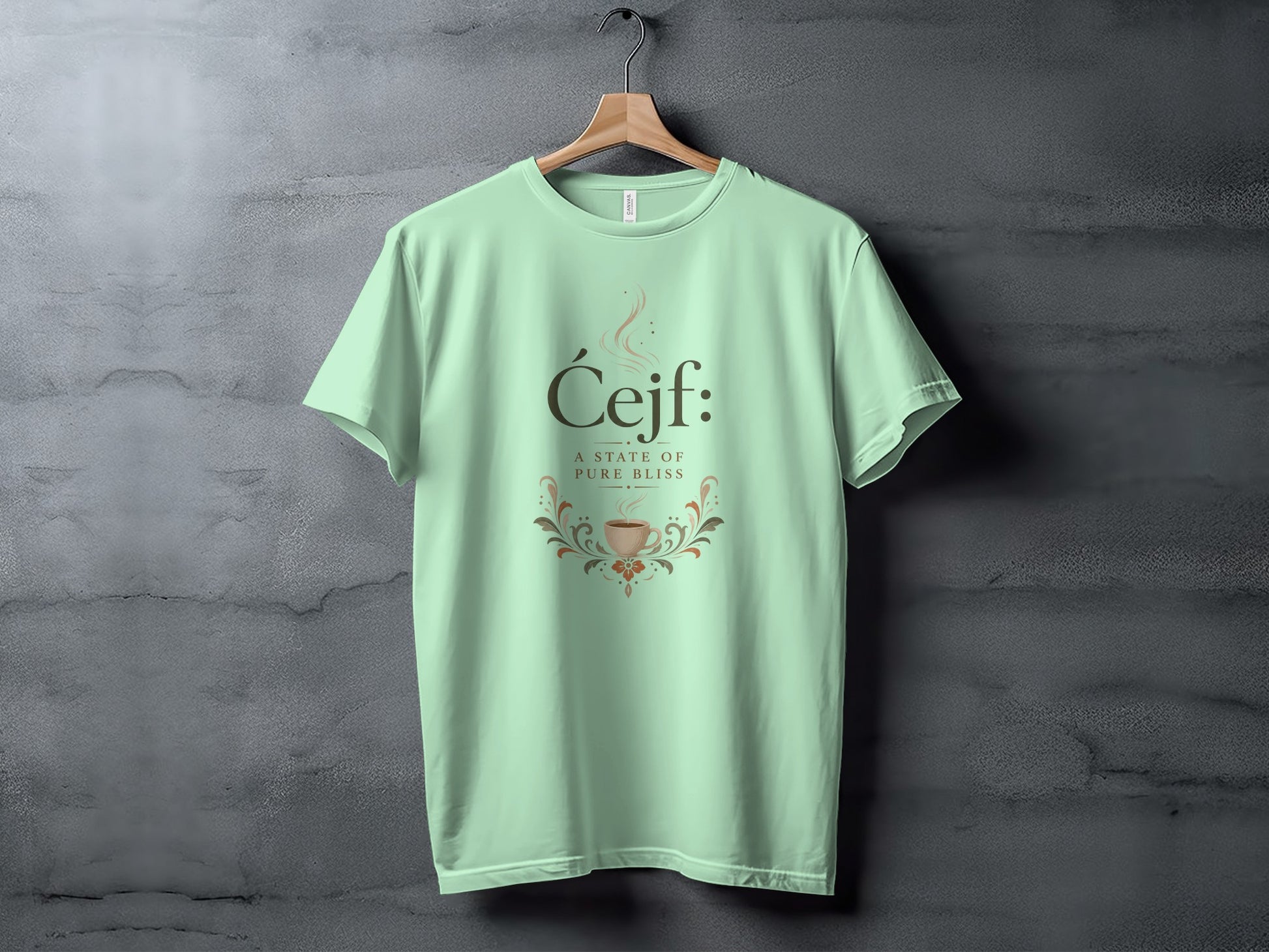Light green t-shirt with "Ćejf: A state of pure bliss" and coffee cup design.