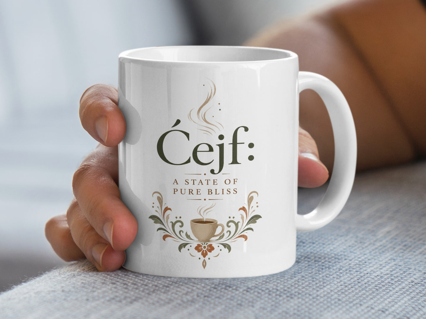 White mug with "Čejf: a state of pure bliss" and a coffee cup design.