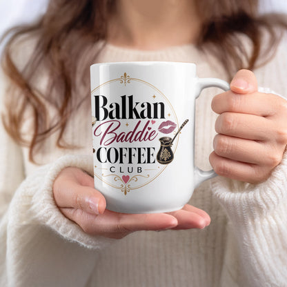 White mug with "Balkan Baddie Coffee Club" text and coffee pot design.