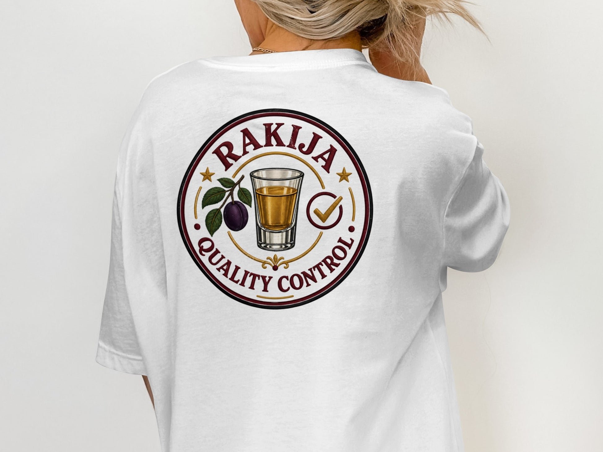T-shirt back with "Rakija Quality Control" circular logo featuring plum brandy glass.