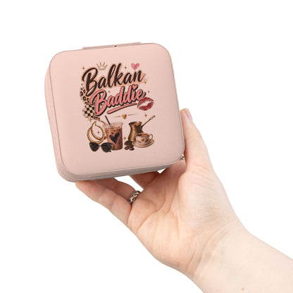 Pink jewelry box with 'Balkan Baddie' text, coffee, sunglasses, and lips design.