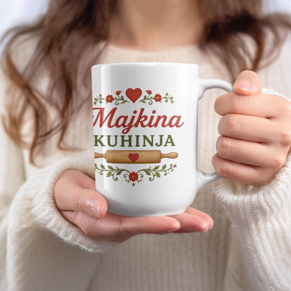 White mug with "Majkina KUHINJA" text and decorative floral elements.