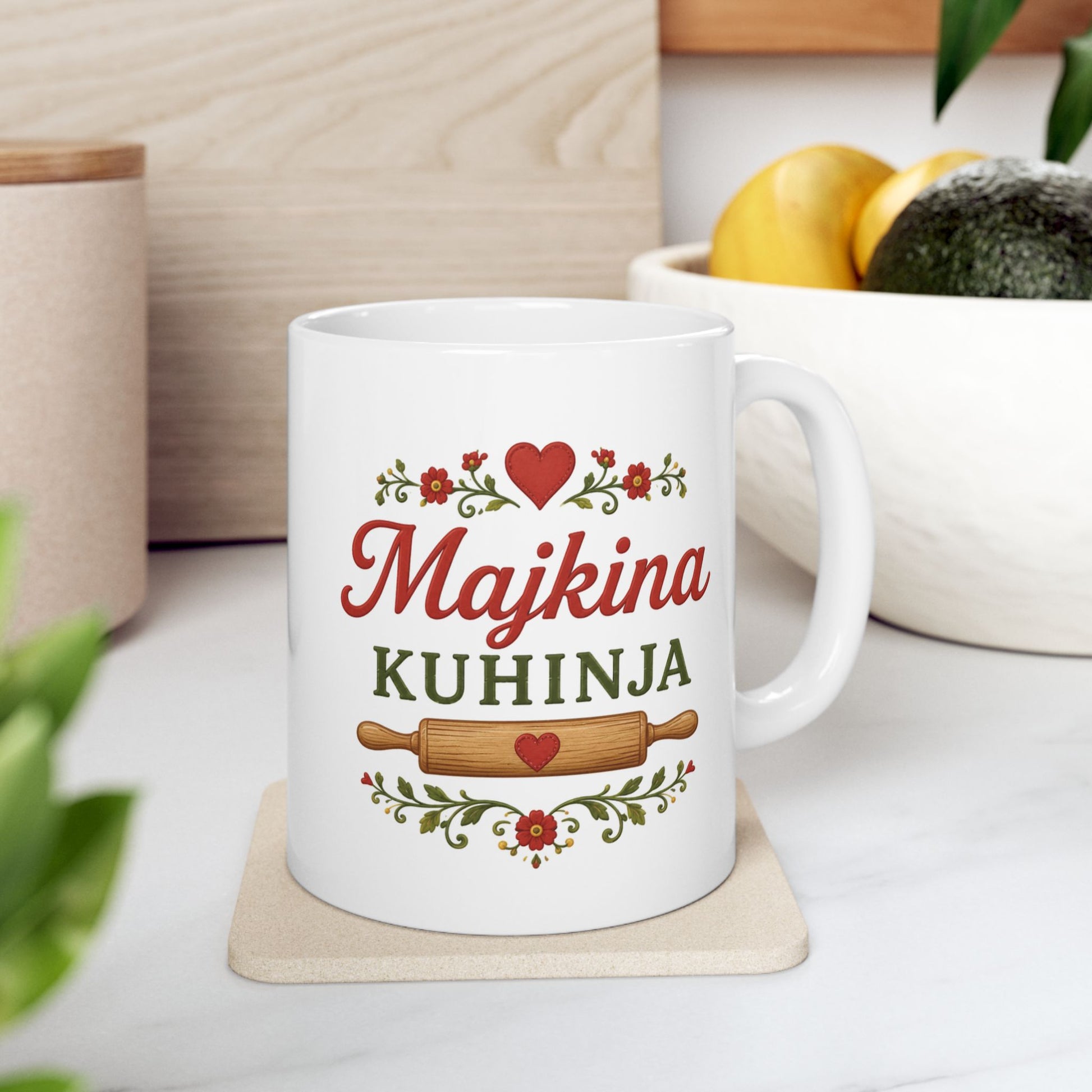 White mug with "Majkina KUHINJA" in decorative script and a rolling pin.