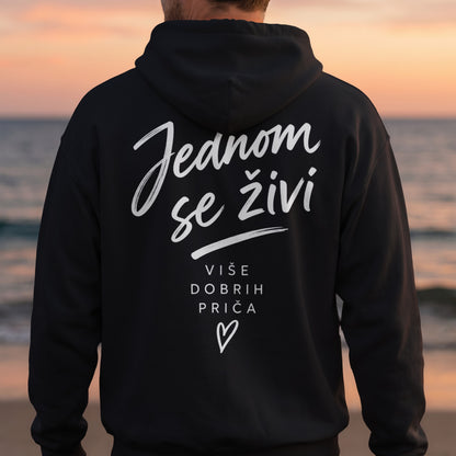 Black hoodie with white text: "Jednom se živi" and "više dobrih priča" with a heart.