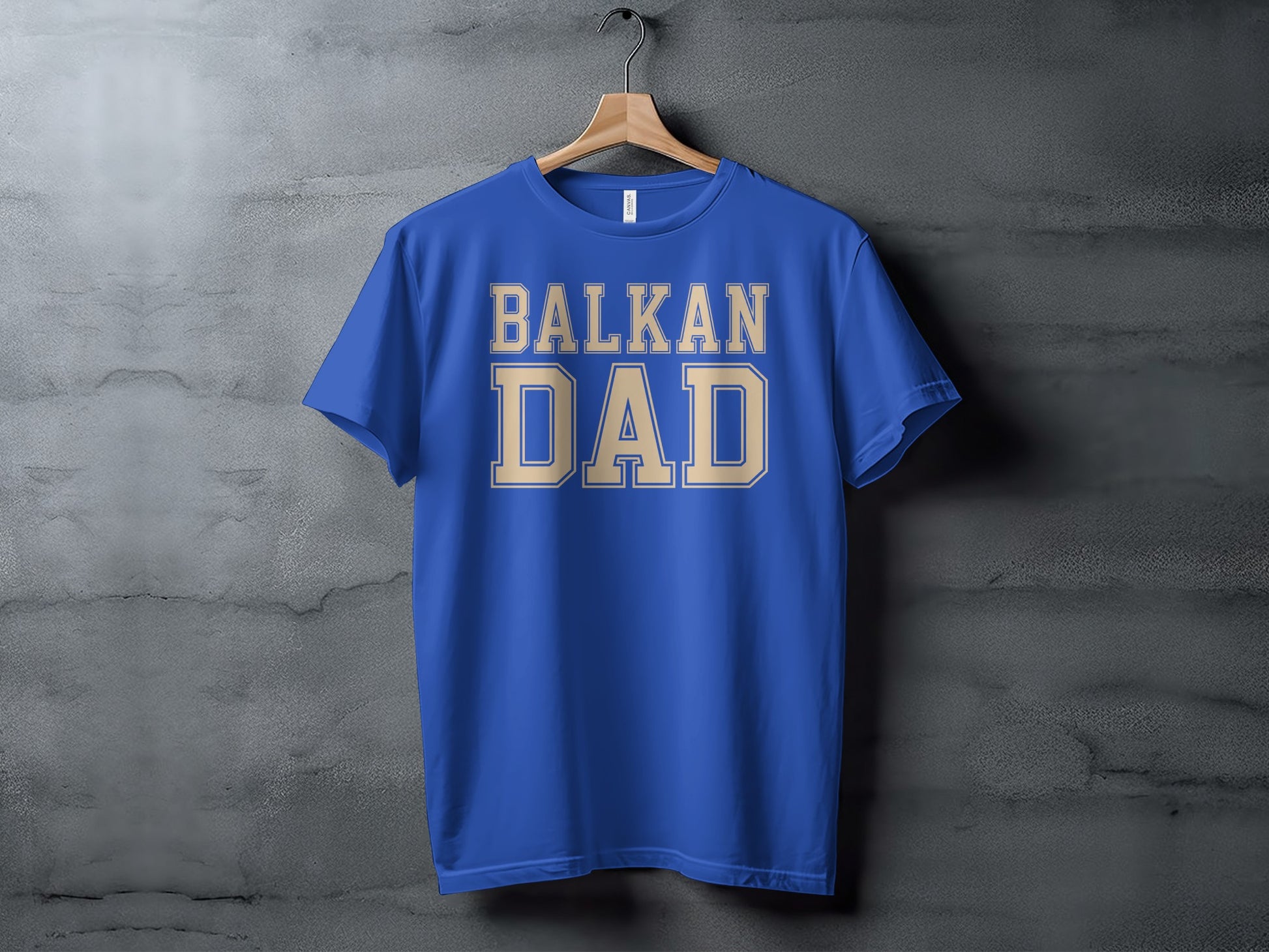 Blue t-shirt with "BALKAN DAD" in tan collegiate lettering.