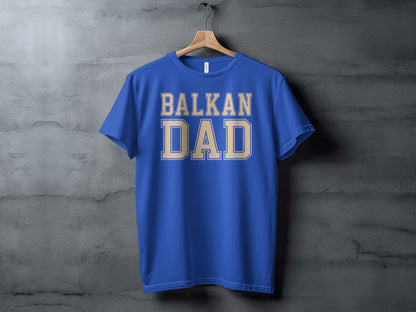 Blue t-shirt with "BALKAN DAD" in tan collegiate lettering.