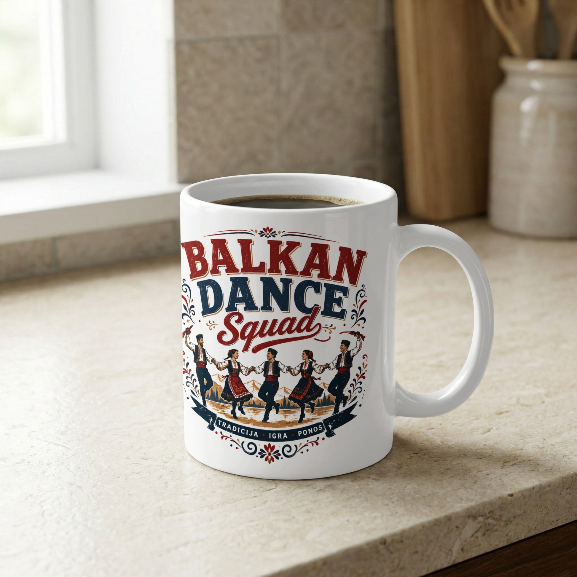 White mug with "BALKAN DANCE Squad" and people in traditional dress dancing.