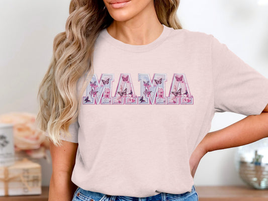 Mama text with butterflies on a light pink t-shirt.