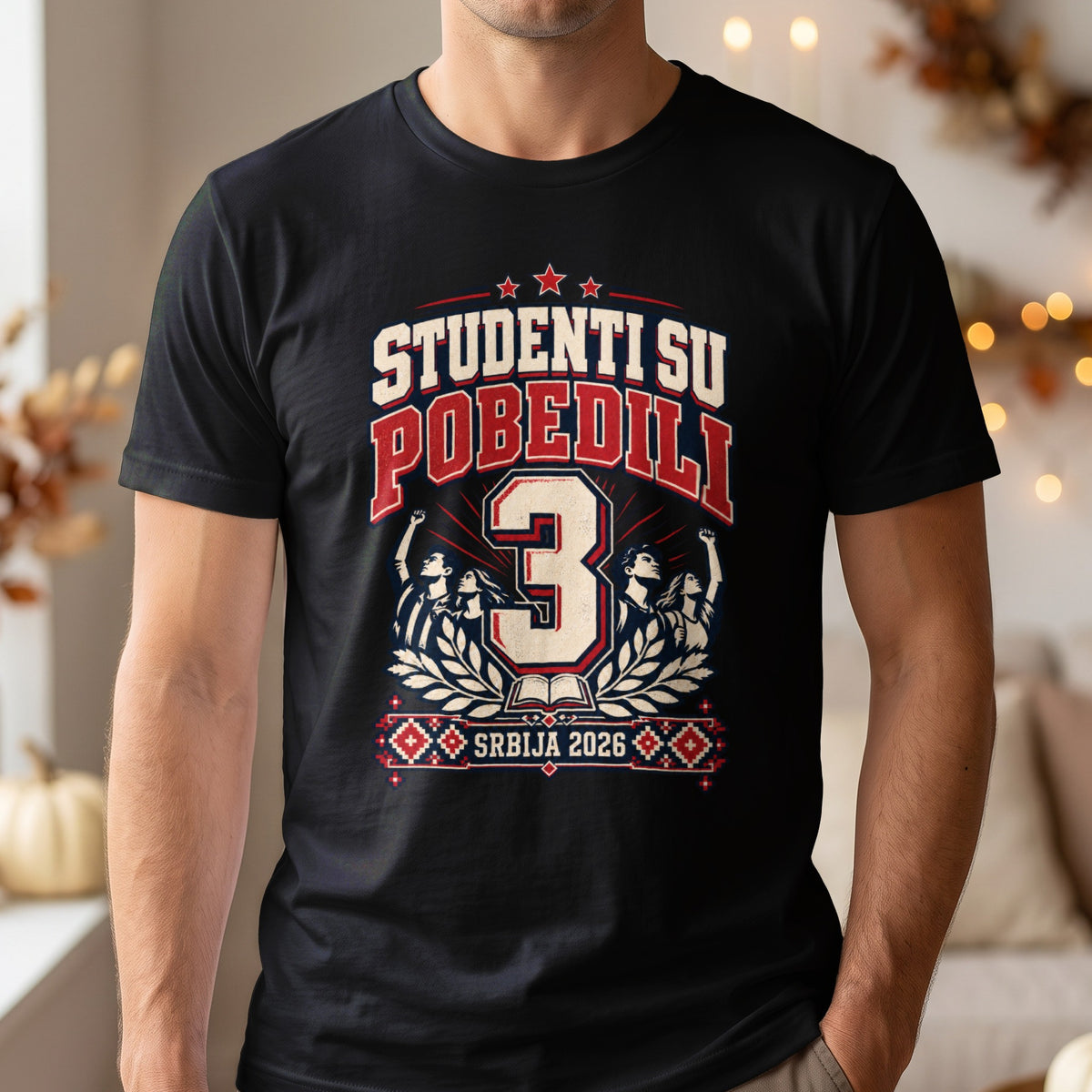 A person wearing a black t-shirt printed with text and graphics celebrating students in Serbia.