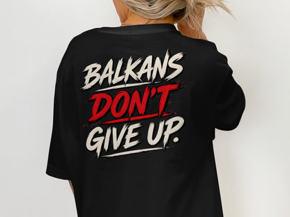 Black t-shirt with "BALKANS DON'T GIVE UP." text design on the back.