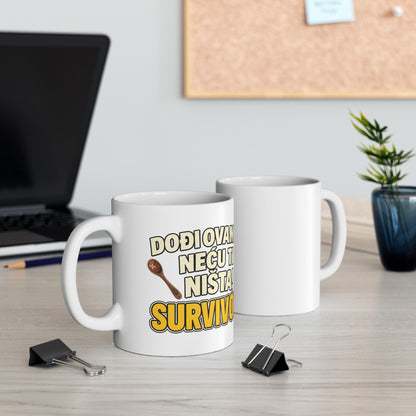 White mug with text and spoon graphic, on a desk.