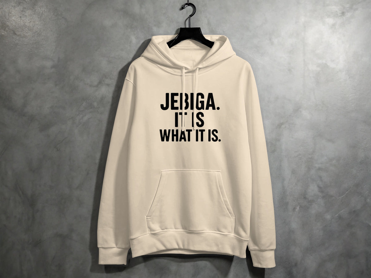 Cream hoodie with black text that reads "JEBIGA. IT IS WHAT IT IS."