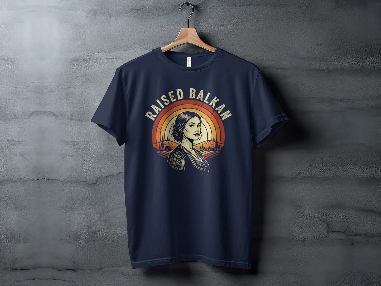 Navy t-shirt with Raised Balkan design featuring woman and sunset.
