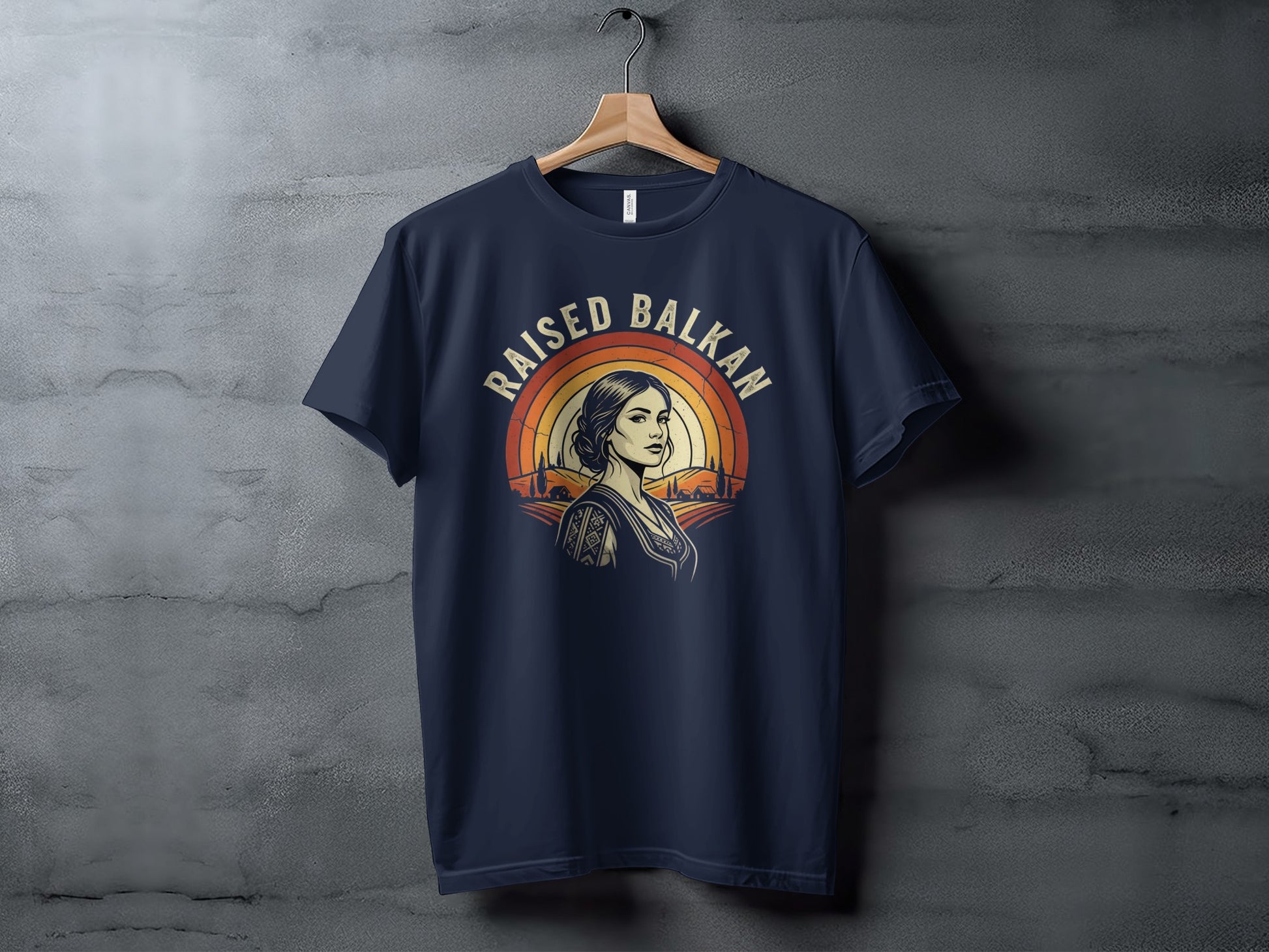 Navy t-shirt with Raised Balkan design featuring woman and sunset.