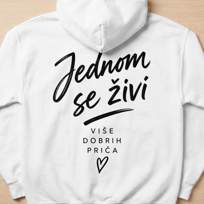 White hoodie with black text "Jednom se živi" and "Više dobrih priča" with a heart.
