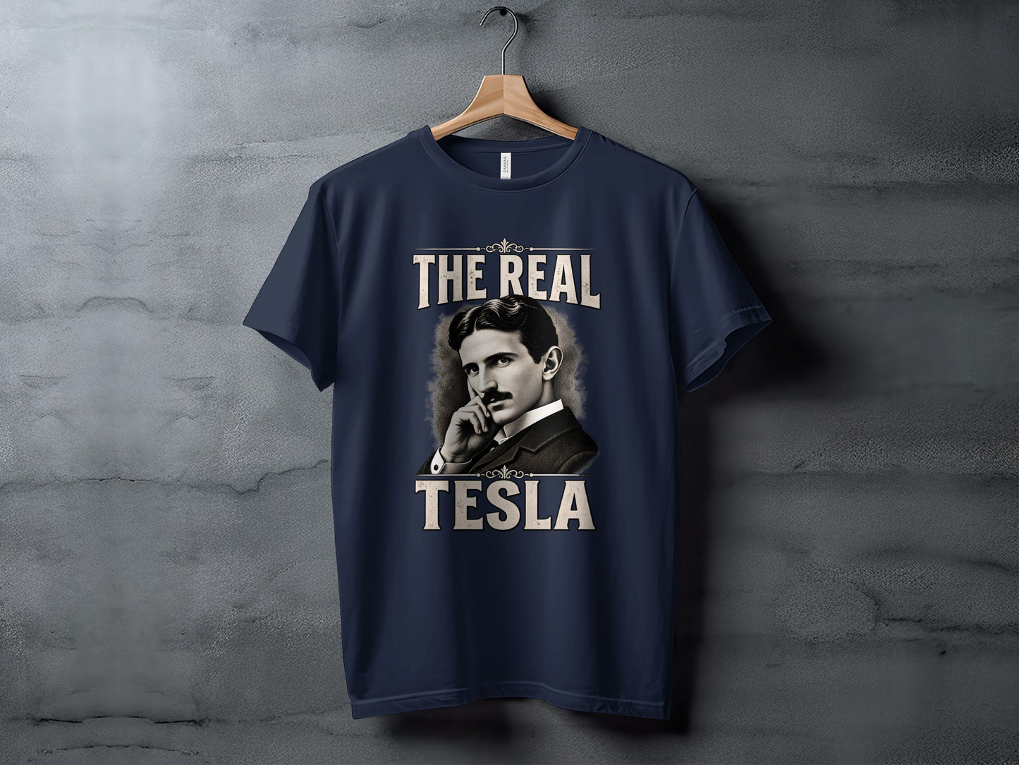 Navy t-shirt with "The Real Tesla" text and portrait of Nikola Tesla.