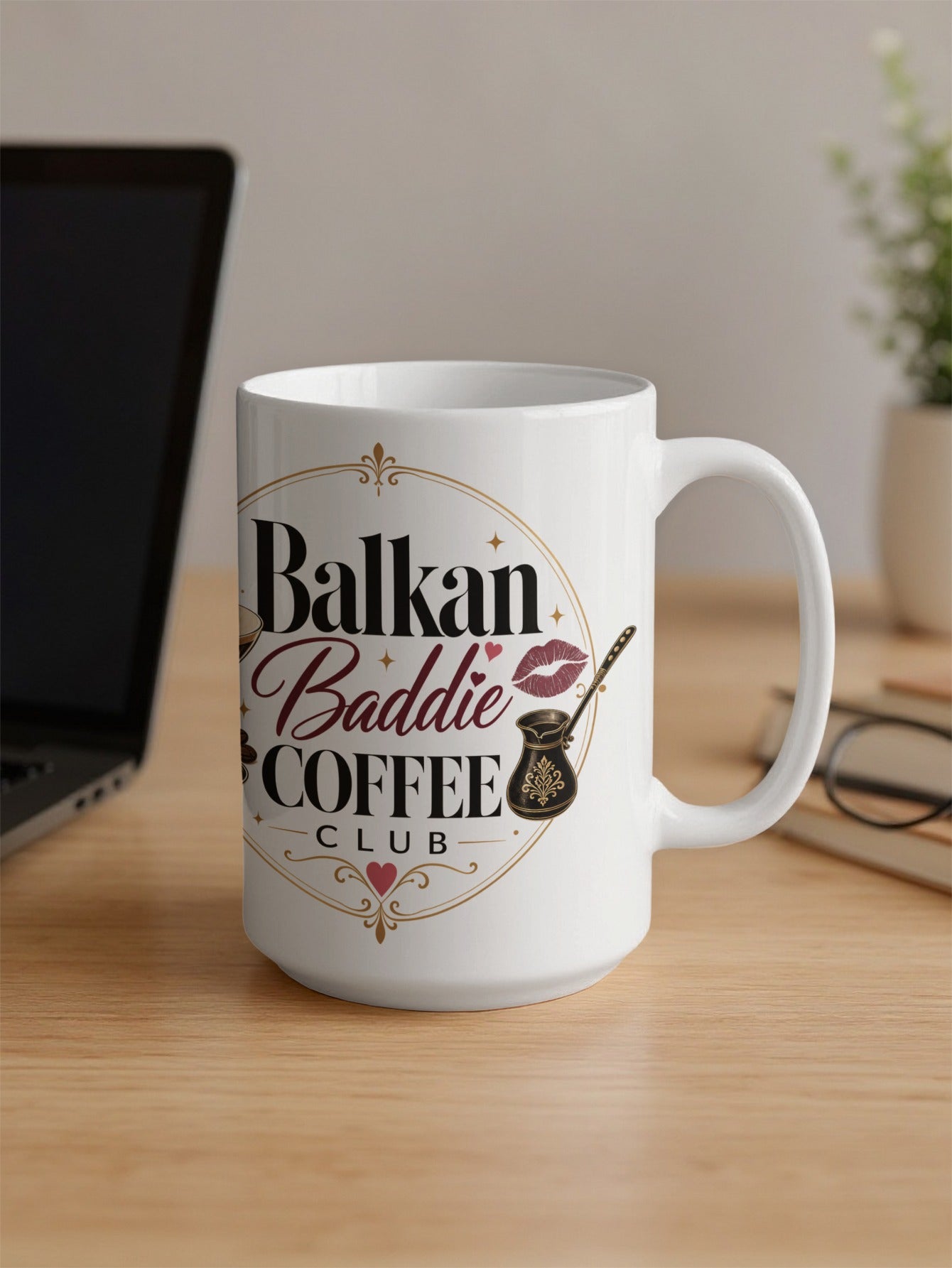 White mug with "Balkan Baddie Coffee Club" text and a kiss.