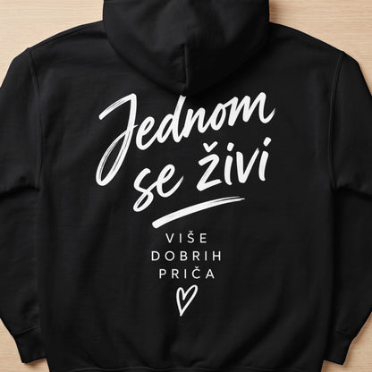 Black hoodie with white text "Jednom se živi" and "VIŠE DOBRIH PRIČA".