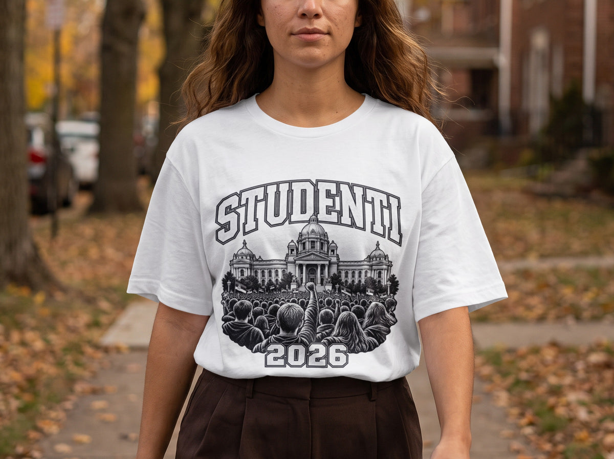 A person wearing a white t-shirt featuring a black and white graphic of a crowd protesting in front of a government building, with the text "STUDENTI" and "2026".
