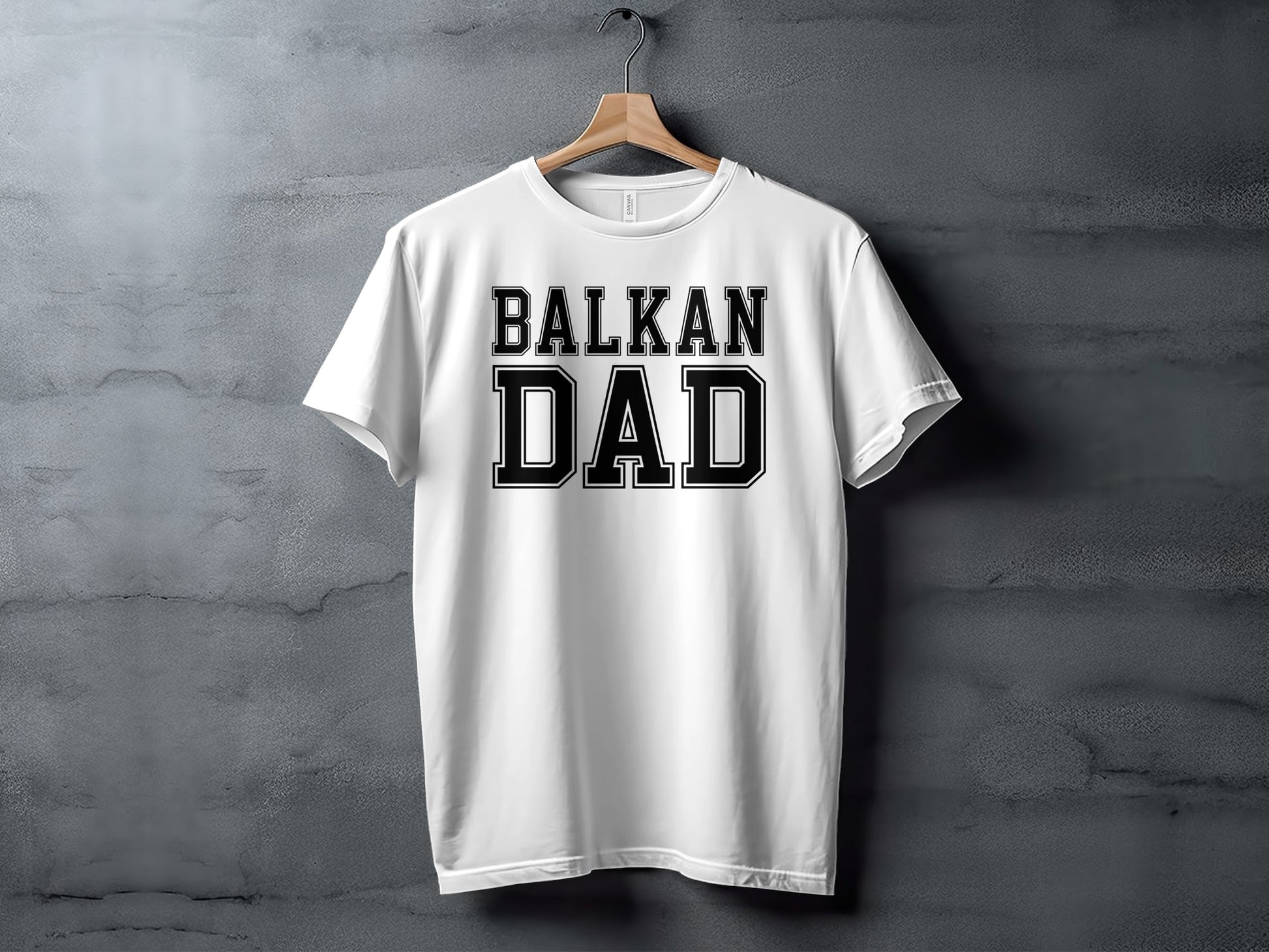 White t-shirt with "BALKAN DAD" in black collegiate lettering.