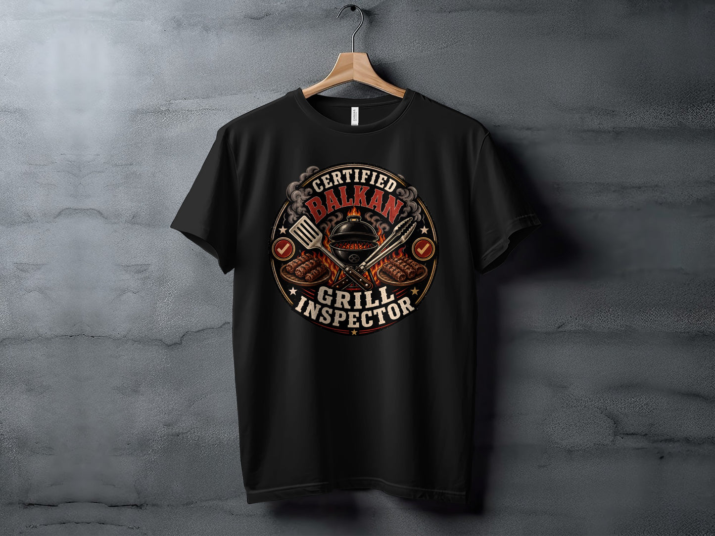 Black t-shirt with a circular graphic of grilling tools and "Certified Balkan Grill Inspector" text.