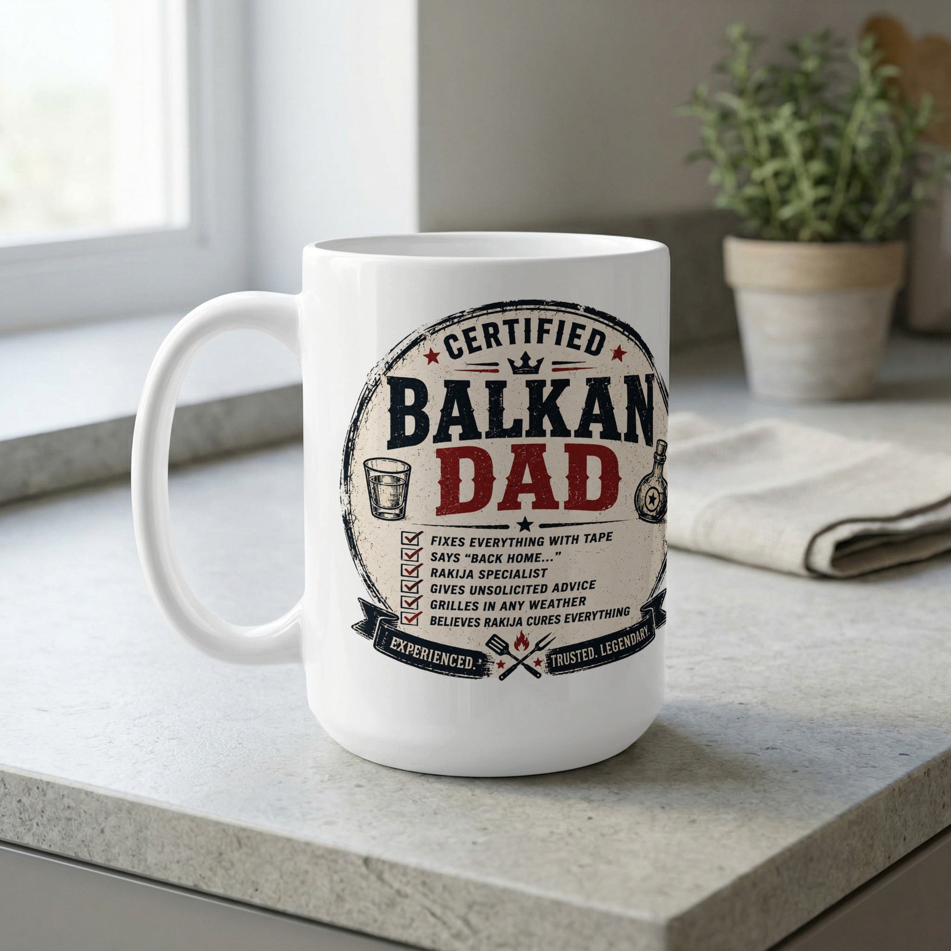 White ceramic mug with "Certified Balkan Dad" text and humorous descriptions.