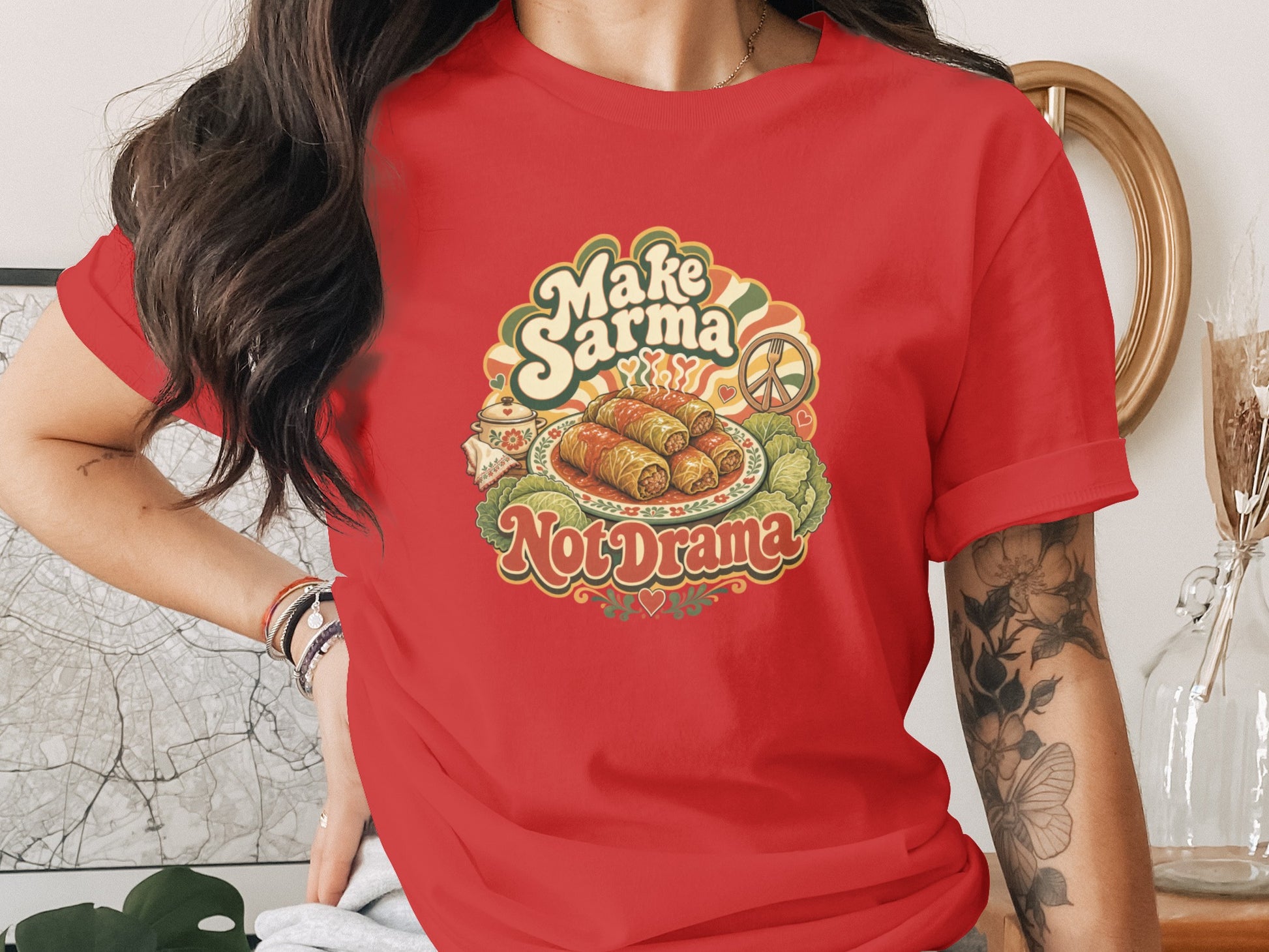 Red t-shirt with "Make Sarma, Not Drama" text and sarma dish graphic.