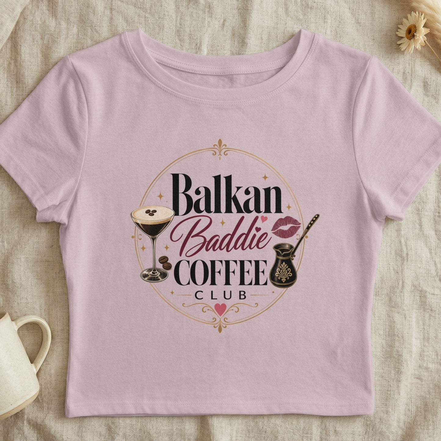 Pink crop top with "Balkan Baddie Coffee Club" graphic and coffee cup.