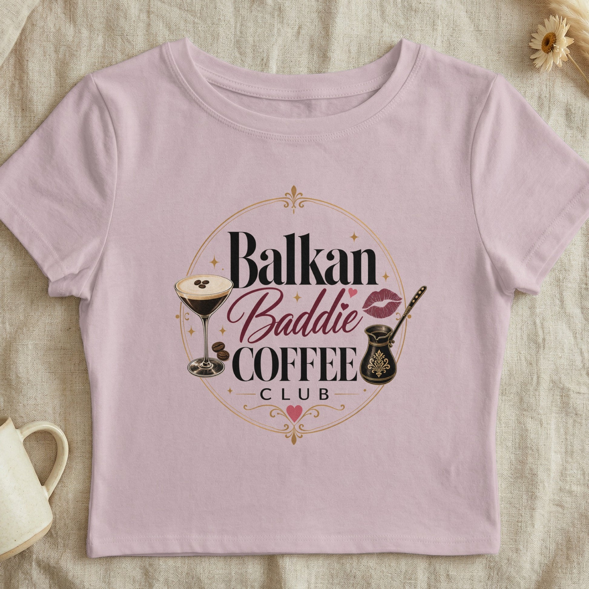 Pink crop top with "Balkan Baddie Coffee Club" graphic and coffee cup.