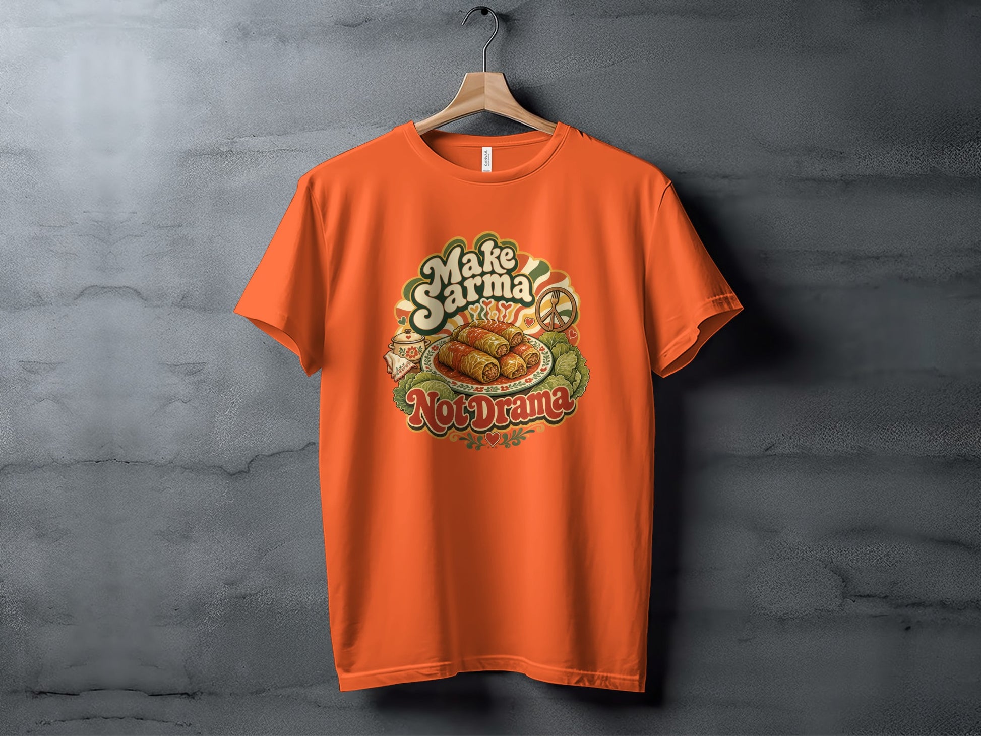 Orange t-shirt with "Make Sarma Not Drama" graphic featuring stuffed grape leaves.