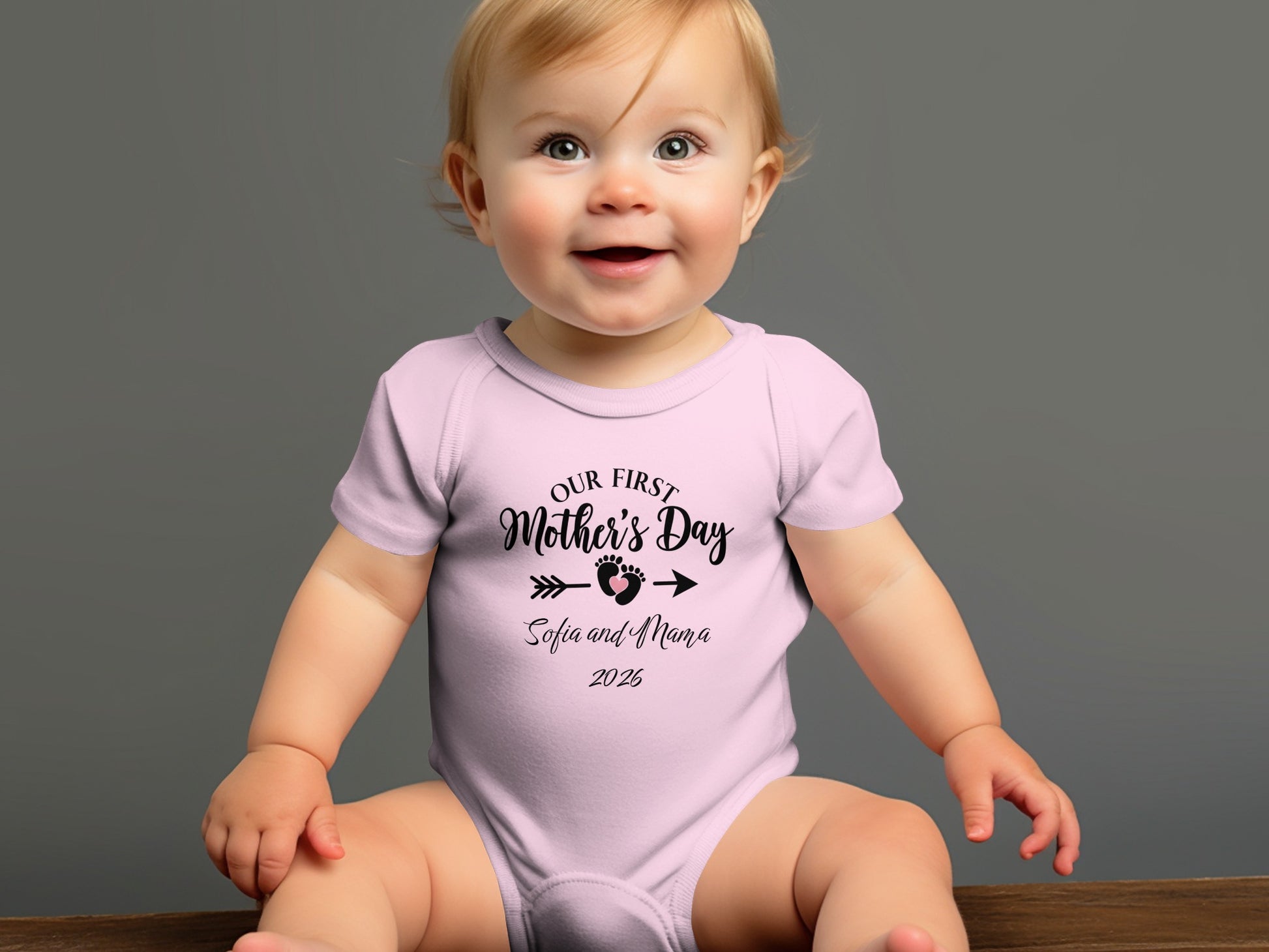 Baby wearing pink "Our First Mother's Day Sofia and Mama 2026" bodysuit.