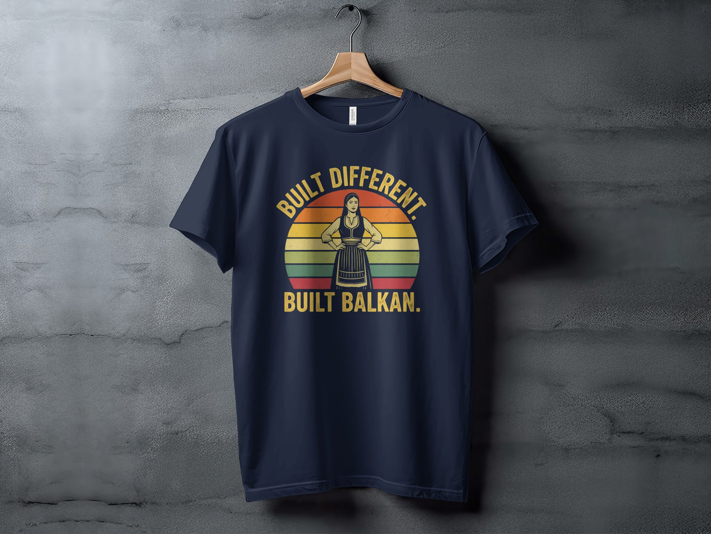 Navy t-shirt with "Built Different. Built Balkan." text and a silhouette.