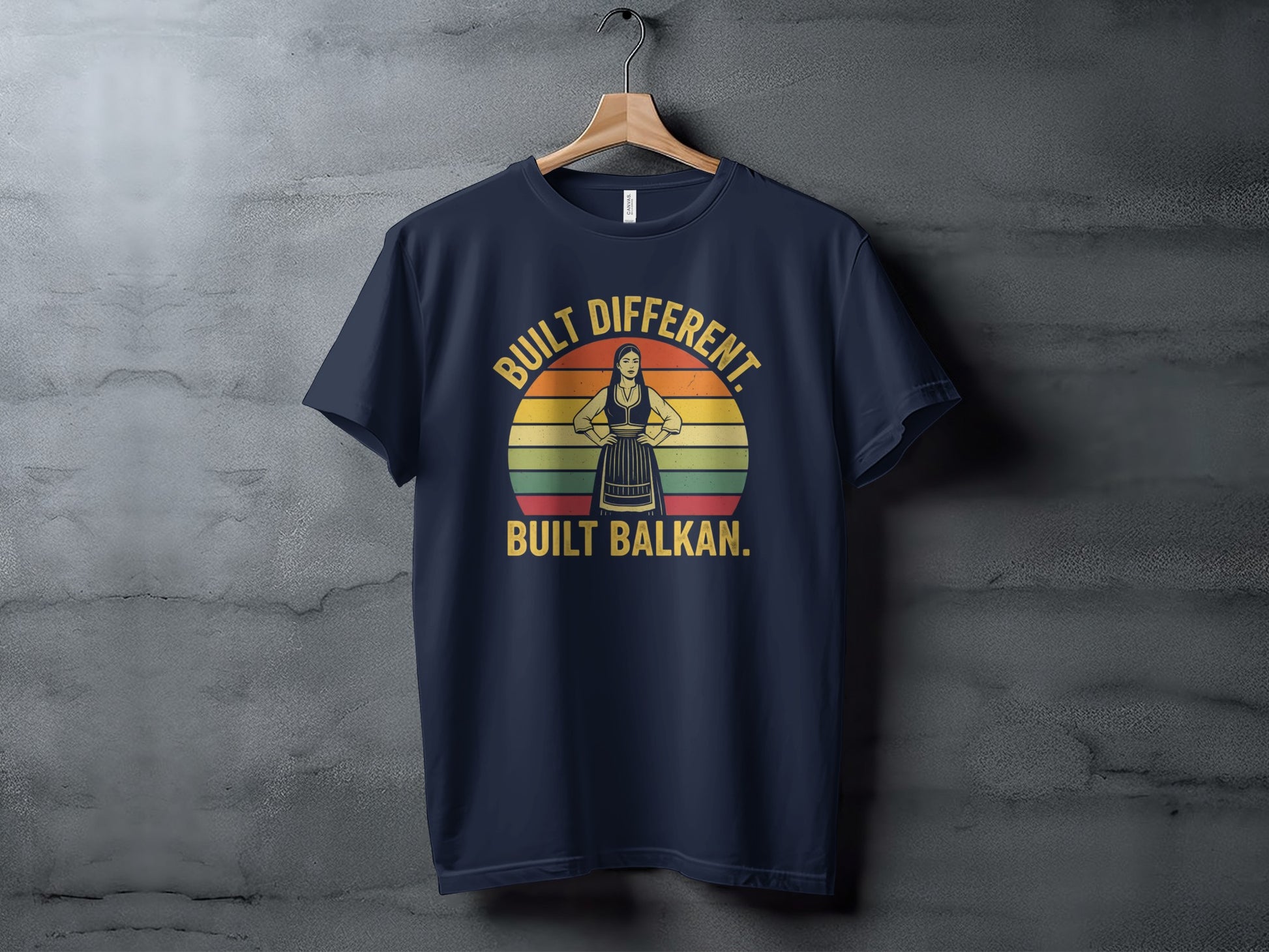 Navy t-shirt with "Built Different. Built Balkan." text and a silhouette.