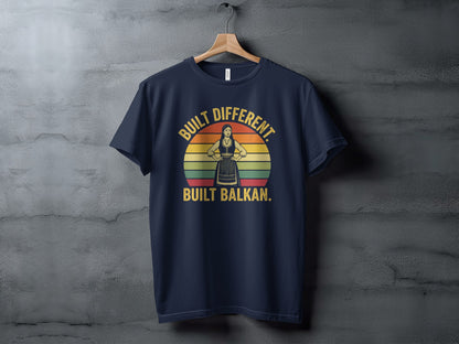 Navy t-shirt with "Built Different. Built Balkan." text and a silhouette.