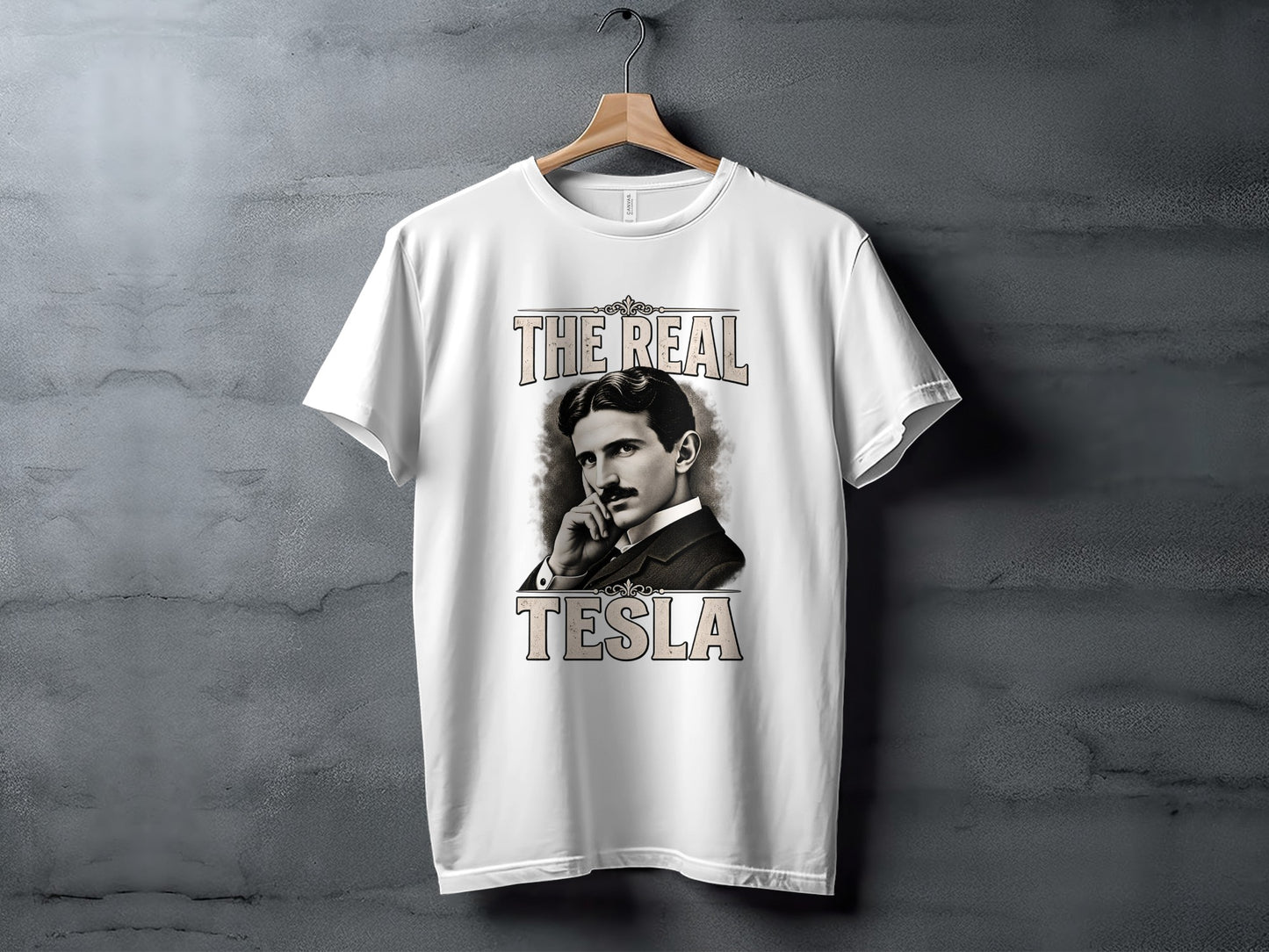 White t-shirt with portrait of Nikola Tesla and text "THE REAL TESLA".