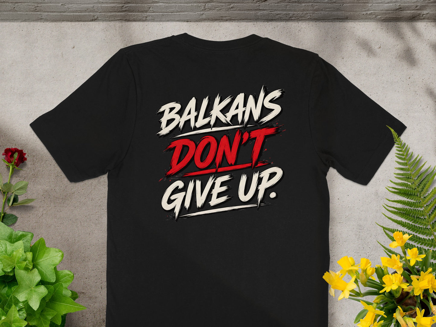 Black t-shirt with bold red and white text: BALKANS DON'T GIVE UP.